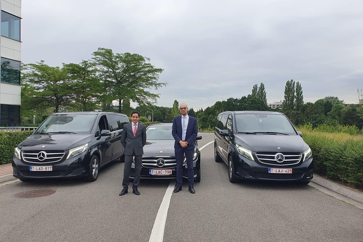 Fleet of luxury Mercedes Benz vehicles for airport transfer services in Brussels, including minivans and sedans.